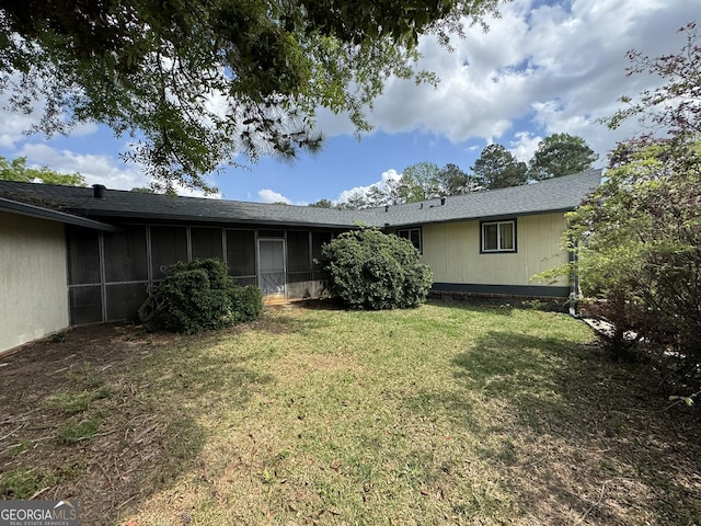 2461 Mcalpin Ter, East Point, GA 30344 - back of house with a sunroom and a lawn