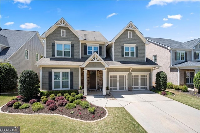 3883 Wakefield Hall Sq SE, Smyrna, GA 30080 - craftsman-style home featuring driveway, an attached garage, a front lawn, and a porch