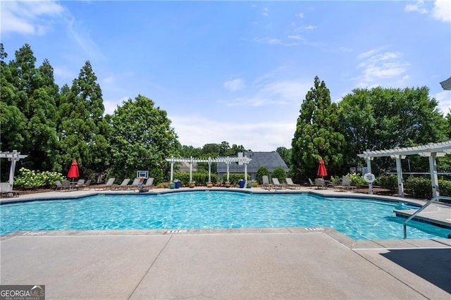 3883 Wakefield Hall Sq SE, Smyrna, GA 30080 - community pool featuring a pergola, a patio, and view of wooded area