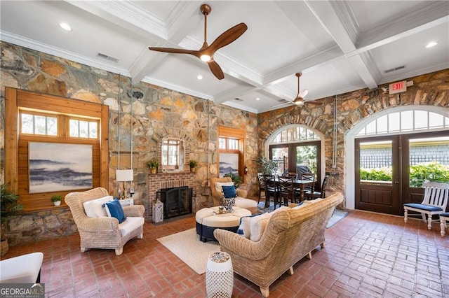 3883 Wakefield Hall Sq SE, Smyrna, GA 30080 - living room featuring a ceiling fan, beamed ceiling, a fireplace, ornamental molding, and coffered ceiling
