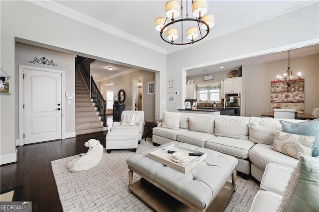 3883 Wakefield Hall Sq SE, Smyrna, GA 30080 - living area with a chandelier, wood finished floors, stairway, ornamental molding, and baseboards