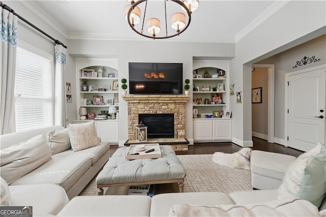 3883 Wakefield Hall Sq SE, Smyrna, GA 30080 - living area with a chandelier, ornamental molding, built in features, a stone fireplace, and baseboards