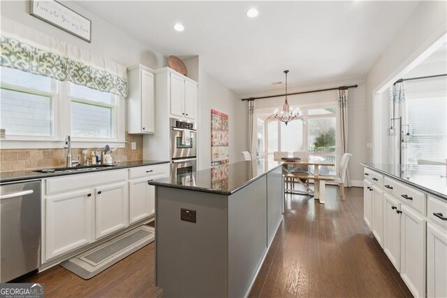 3883 Wakefield Hall Sq SE, Smyrna, GA 30080 - kitchen with a sink, stainless steel appliances, a chandelier, plenty of natural light, and recessed lighting
