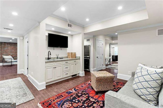 5790 Heards Forest Dr, Atlanta, GA 30328 - living room featuring baseboards, ornamental molding, dark wood-style floors, and visible vents