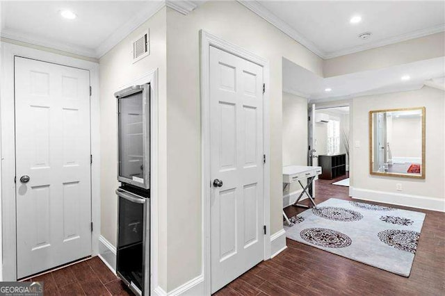 5790 Heards Forest Dr, Atlanta, GA 30328 - hall featuring crown molding, baseboards, wood finished floors, and visible vents