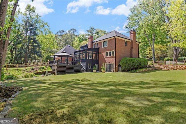 5790 Heards Forest Dr, Atlanta, GA 30328 - back of property featuring a wooden deck, fence, a chimney, stairs, and a lawn
