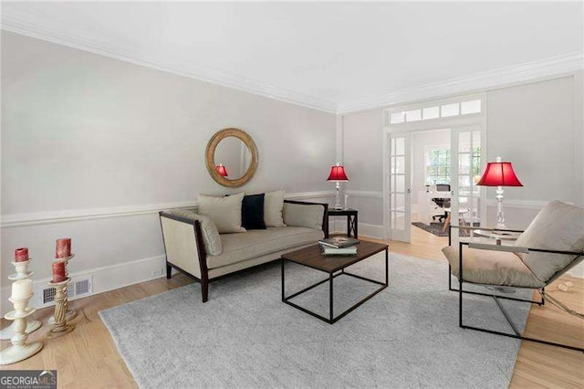 5790 Heards Forest Dr, Atlanta, GA 30328 - living area with crown molding, french doors, wood finished floors, and visible vents