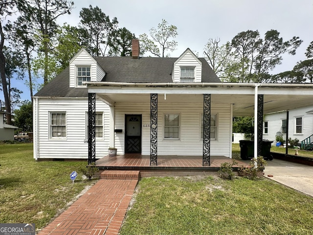 623 Mcdonald St, Waycross, GA 31503 - view of front of property with a porch, a front lawn, a chimney, and roof with shingles