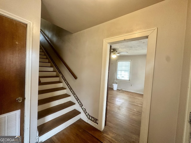 623 Mcdonald St, Waycross, GA 31503 - staircase with hardwood / wood-style floors and a ceiling fan