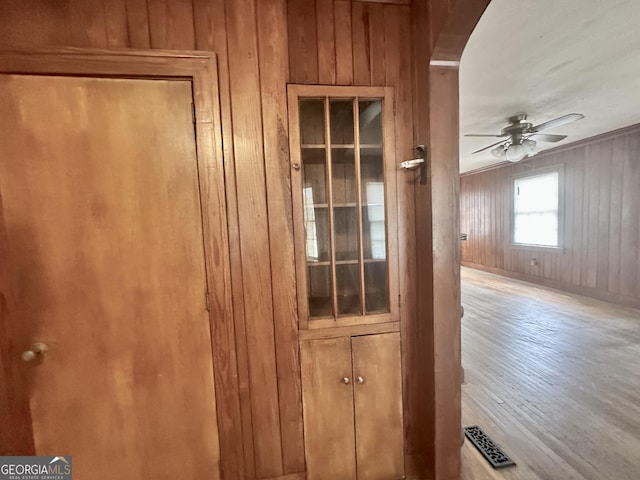 623 Mcdonald St, Waycross, GA 31503 - detailed view of wooden walls, ceiling fan, and wood finished floors