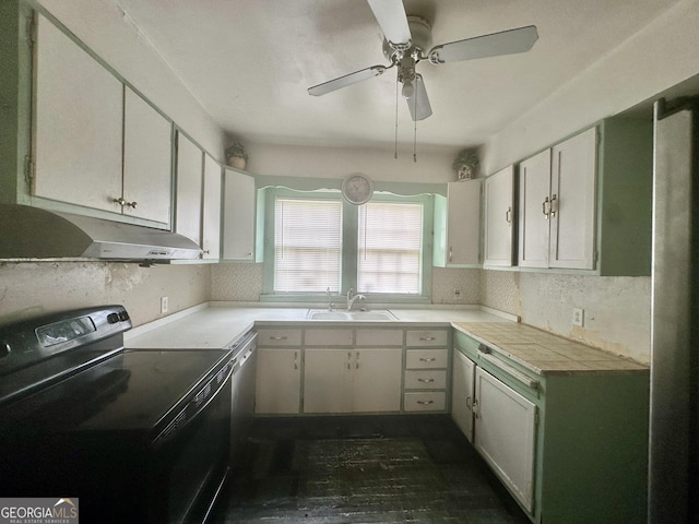 623 Mcdonald St, Waycross, GA 31503 - kitchen featuring black electric range, under cabinet range hood, ceiling fan, and light countertops