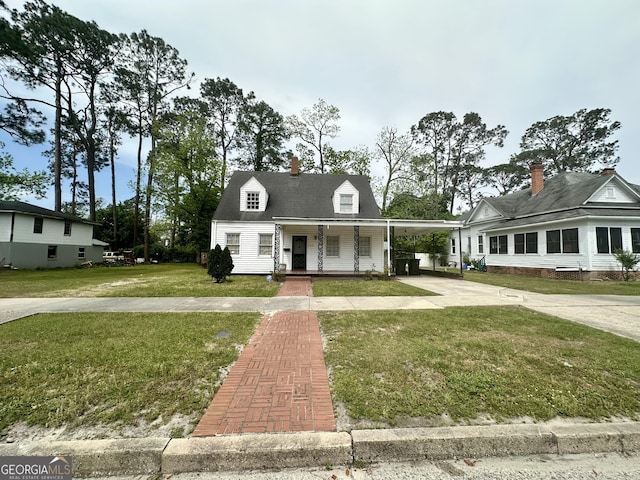 623 Mcdonald St, Waycross, GA 31503 - view of front of property with a porch, concrete driveway, a front lawn, and an attached carport