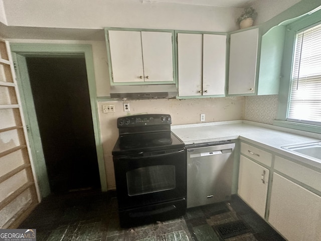 623 Mcdonald St, Waycross, GA 31503 - kitchen featuring black / electric stove, dishwasher, under cabinet range hood, light countertops, and white cabinets