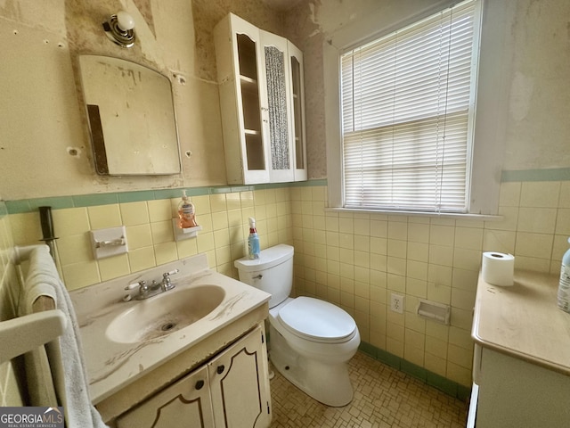 623 Mcdonald St, Waycross, GA 31503 - bathroom featuring tile walls, vanity, tile patterned floors, and wainscoting