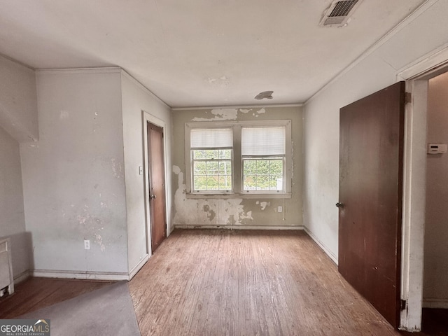 623 Mcdonald St, Waycross, GA 31503 - unfurnished bedroom featuring wood finished floors and ornamental molding