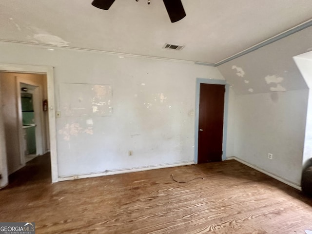 623 Mcdonald St, Waycross, GA 31503 - empty room with ceiling fan, vaulted ceiling, and wood finished floors