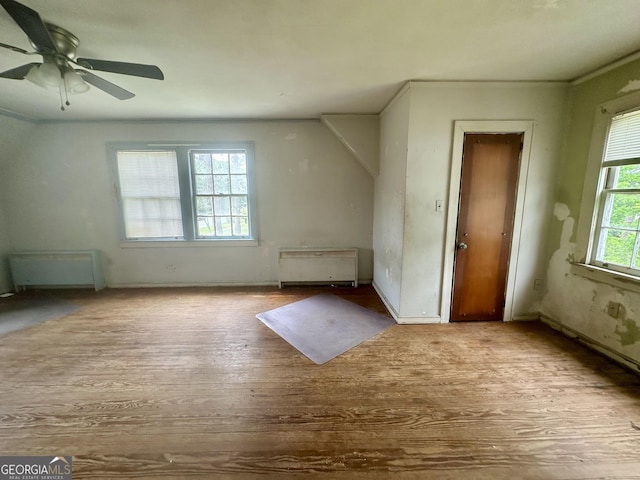 623 Mcdonald St, Waycross, GA 31503 - bonus room featuring wood finished floors, ceiling fan, and radiator