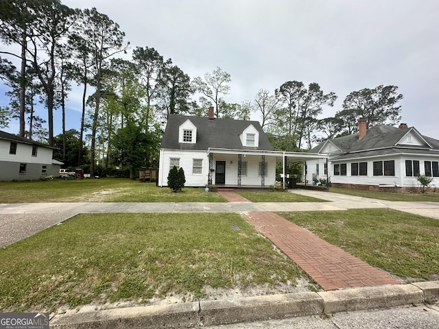 623 Mcdonald St, Waycross, GA 31503 - view of front of home with a porch, a front lawn, a carport, and driveway