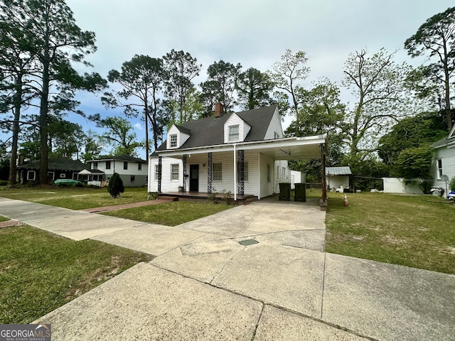 623 Mcdonald St, Waycross, GA 31503 - view of front facade featuring covered porch, a front lawn, concrete driveway, and an attached carport