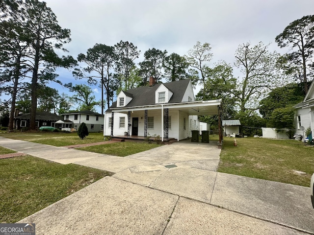 623 Mcdonald St, Waycross, GA 31503 - view of front of house featuring covered porch, driveway, a front yard, and a carport
