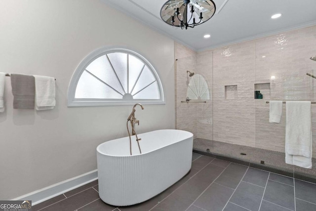 1811 Fountain Hill Ct, Duluth, GA 30097 - bathroom featuring tiled shower, a freestanding bath, a chandelier, tile patterned floors, and ornamental molding