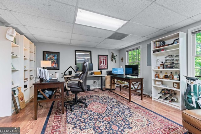 1811 Fountain Hill Ct, Duluth, GA 30097 - home office featuring wood finished floors, a drop ceiling, and plenty of natural light