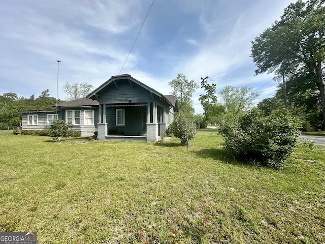 2409 Dorothy St, Waycross, GA 31501 - rear view of property featuring a yard