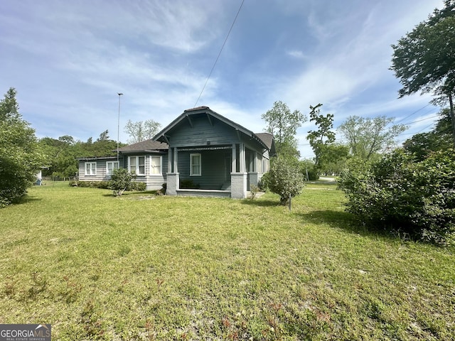 2409 Dorothy St, Waycross, GA 31501 - rear view of house featuring a yard