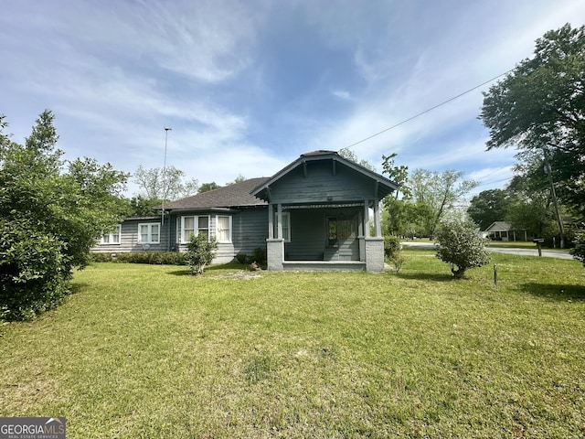 2409 Dorothy St, Waycross, GA 31501 - back of house featuring a lawn