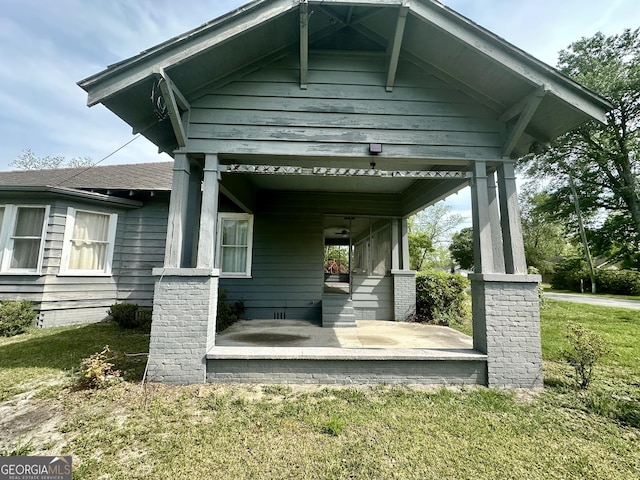 2409 Dorothy St, Waycross, GA 31501 - back of house with a porch and a yard