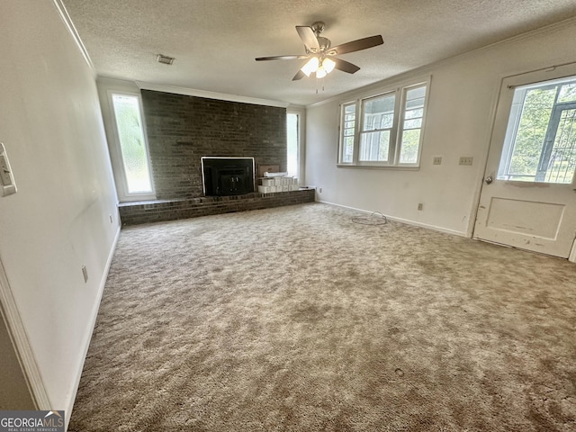 2409 Dorothy St, Waycross, GA 31501 - unfurnished living room with ornamental molding, a textured ceiling, healthy amount of natural light, carpet flooring, and a ceiling fan