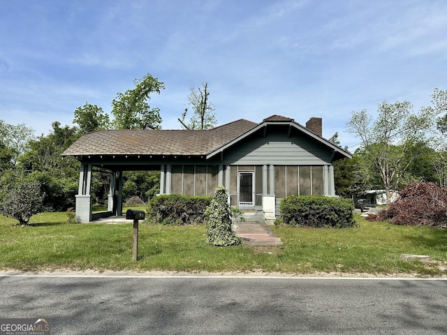 2409 Dorothy St, Waycross, GA 31501 - view of front of house with a front lawn and a chimney