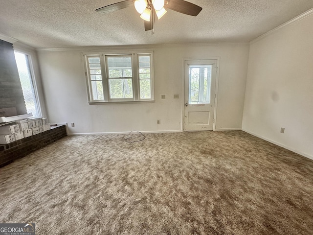 2409 Dorothy St, Waycross, GA 31501 - unfurnished living room featuring crown molding, carpet floors, a textured ceiling, ceiling fan, and baseboards