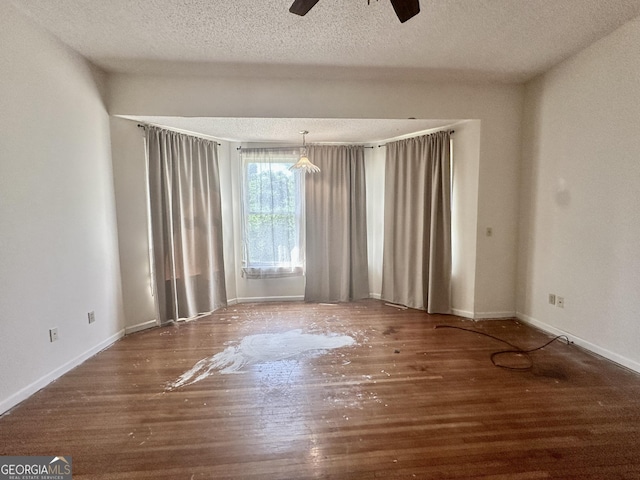 2409 Dorothy St, Waycross, GA 31501 - unfurnished room with wood finished floors, a ceiling fan, a textured ceiling, and baseboards