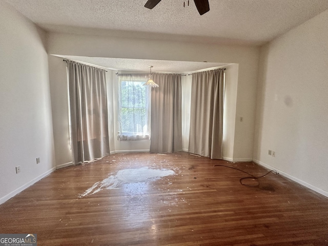 2409 Dorothy St, Waycross, GA 31501 - spare room with a ceiling fan, wood finished floors, a textured ceiling, and baseboards
