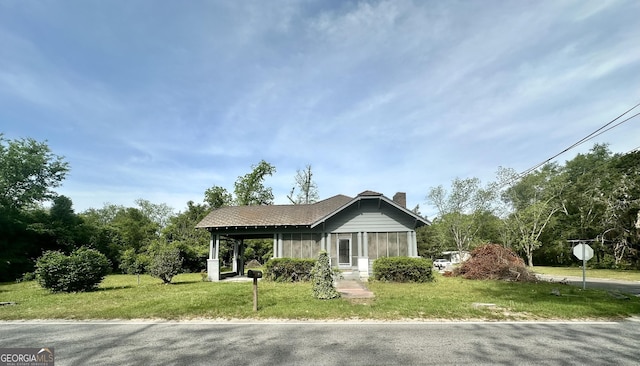 2409 Dorothy St, Waycross, GA 31501 - view of front of house featuring a chimney and a front lawn