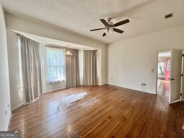 2409 Dorothy St, Waycross, GA 31501 - unfurnished room featuring hardwood / wood-style flooring, ceiling fan, a textured ceiling, and baseboards