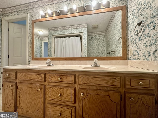 2409 Dorothy St, Waycross, GA 31501 - bathroom featuring wallpapered walls, double vanity, and a textured ceiling