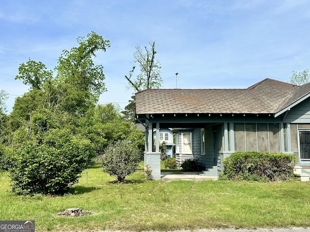 2409 Dorothy St, Waycross, GA 31501 - view of front of house featuring roof with shingles and a front lawn