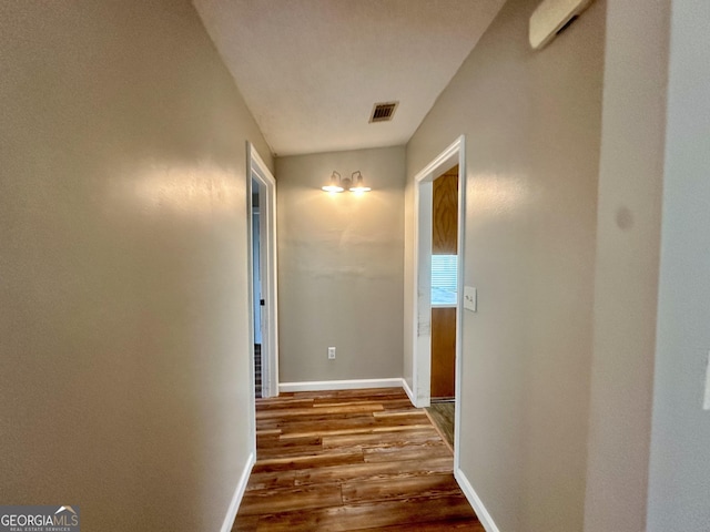 2409 Dorothy St, Waycross, GA 31501 - hallway featuring dark wood-style flooring and baseboards