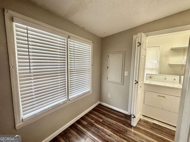 2409 Dorothy St, Waycross, GA 31501 - interior space featuring washer / clothes dryer, baseboards, dark wood-type flooring, and a textured ceiling
