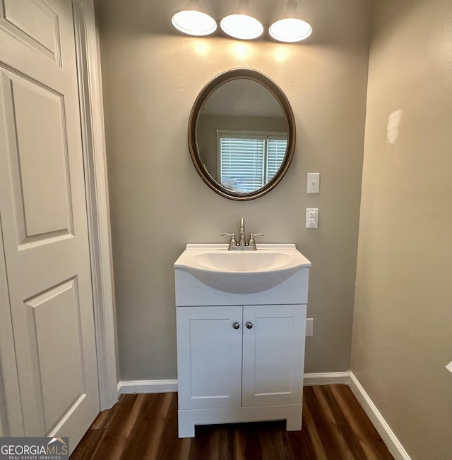 2409 Dorothy St, Waycross, GA 31501 - bathroom featuring wood finished floors, baseboards, and vanity