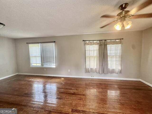 2409 Dorothy St, Waycross, GA 31501 - spare room featuring wood-type flooring, baseboards, a textured ceiling, and a ceiling fan