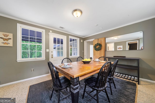 1419 Briarcliff Rd, Macon, GA 31201 - dining space with speckled floor, baseboards, ornamental molding, and visible vents