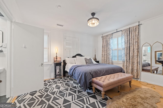 1419 Briarcliff Rd, Macon, GA 31201 - bedroom with visible vents, baseboards, wood finished floors, and crown molding