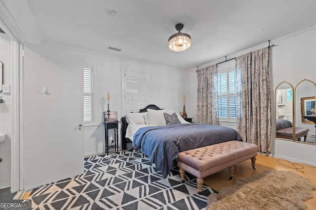 1419 Briarcliff Rd, Macon, GA 31201 - bedroom featuring baseboards, ornamental molding, wood finished floors, and visible vents