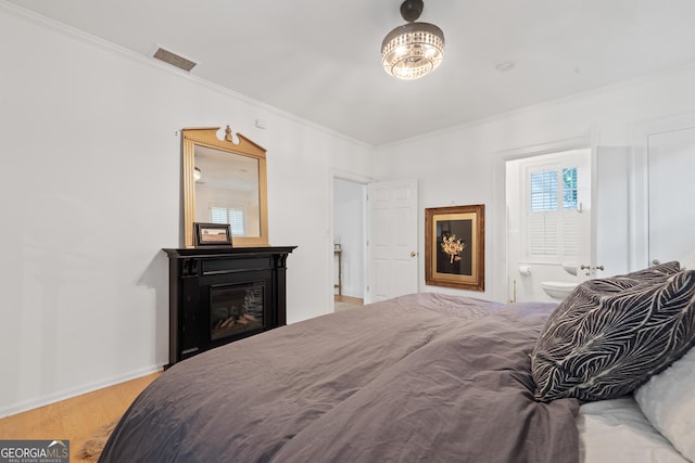 1419 Briarcliff Rd, Macon, GA 31201 - bedroom featuring light wood-type flooring, multiple windows, visible vents, and crown molding