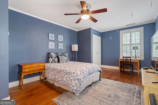 1419 Briarcliff Rd, Macon, GA 31201 - bedroom featuring wood finished floors, visible vents, crown molding, and baseboards