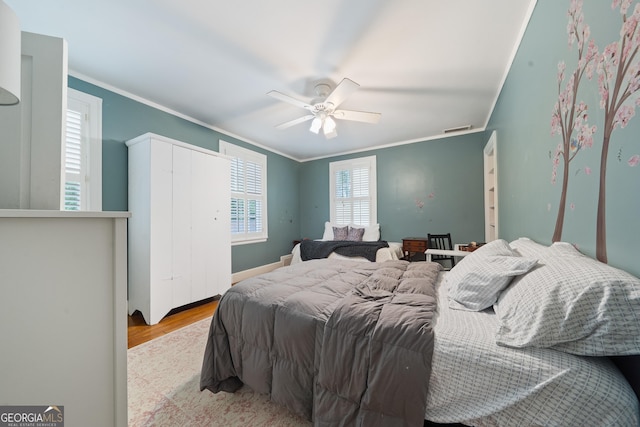 1419 Briarcliff Rd, Macon, GA 31201 - bedroom with wood finished floors, visible vents, a ceiling fan, and ornamental molding