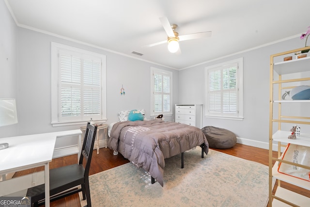 1419 Briarcliff Rd, Macon, GA 31201 - bedroom featuring baseboards, ornamental molding, wood finished floors, and visible vents